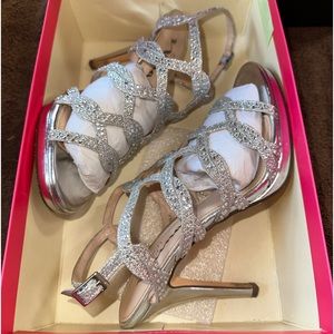 Womans silver rhinestone dressy shoes. Size 6.5M. Worn once to prom.